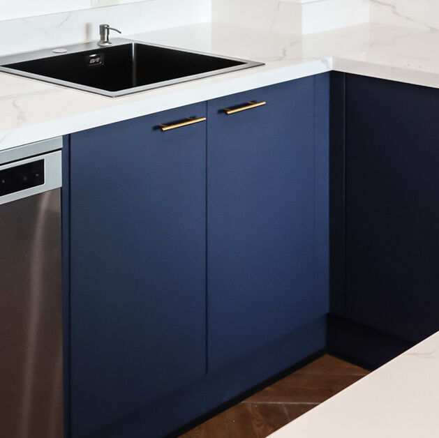 PP vinyl wrapped with navy blue color door in a modern style kitchen.