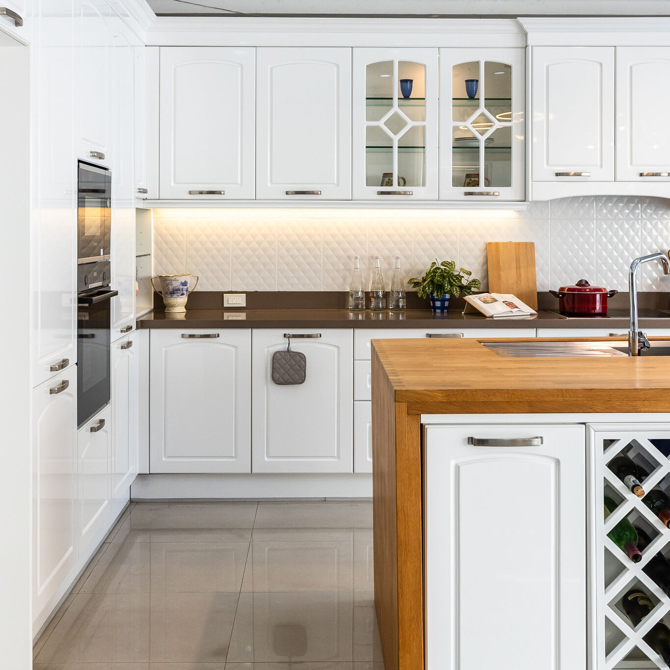 Middleton series kitchen. White spray-painted arched raised-panel doors. contemporary look.